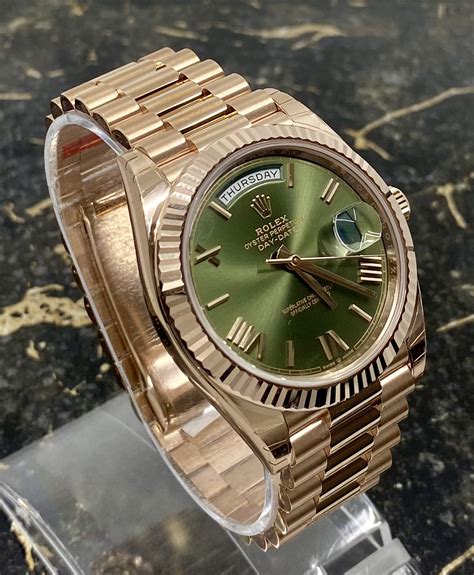 Rolex gold green day date